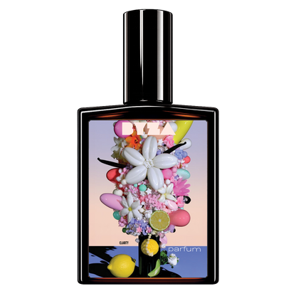 A perfume bottle with a glossy black glass body and a tall cylindrical cap, featuring a colorful floral and fruit-themed label. The label includes a large white flower, pink and purple blossoms, lemons, limes, macarons, and the text 'DIZZY' and 'parfum'.