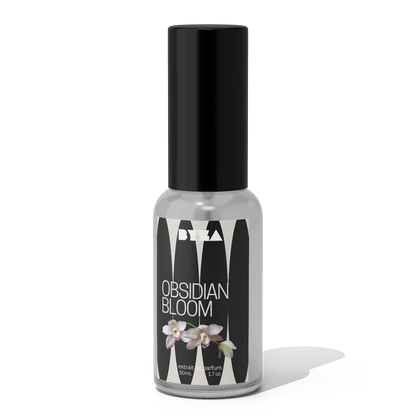 A bottle of Obsidian Bloom perfume with a black cap and a label featuring an image of a white flower.